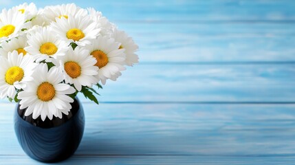 Wall Mural -  a vase filled with white daisies sitting atop a blue wooden table The background is slightly blurred, giving the image a dreamy feel