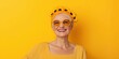 © Iryna - A woman wearing a yellow dress and a sunflower headband is smiling. She is wearing yellow sunglasses and has a bright, happy expression on her face
