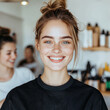 © annmelnikova - Smiling caucasian young female with freckles in modern salon environment