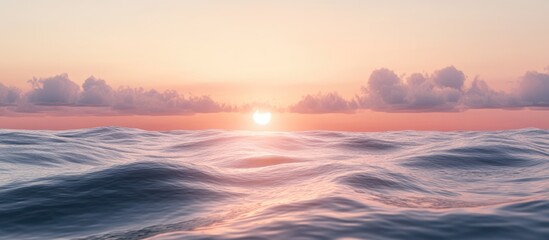 Poster - Serene coastal sunset over gentle ocean waves with clouds and ample space for text or design elements in the sky