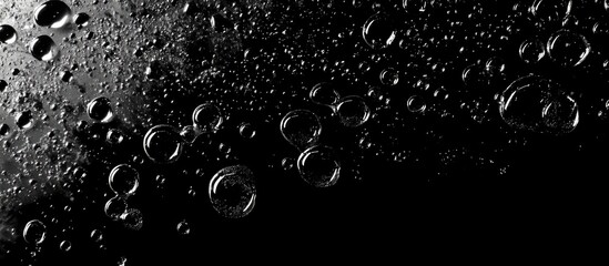 Poster - Misty water droplets with reflections on a dark background creating an abstract ethereal atmosphere for backgrounds or designs.