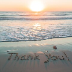 Thank You Written in the Sand with Seashells at Sunset