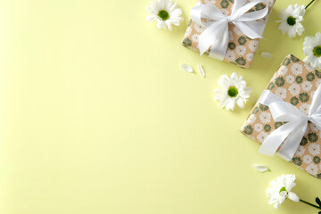 Wall Mural - Happy Mothers Day concept. Flat lay gift boxes with spring flowers on pastel green background.