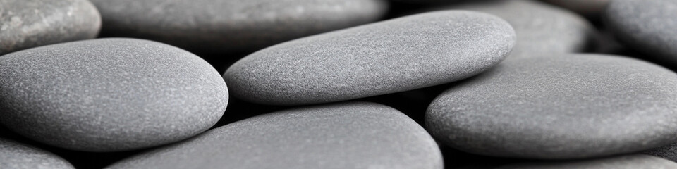 Poster - Smooth gray stones arranged artfully on a surface