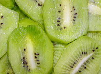 Wall Mural - Background with kiwi slices. Fresh kiwi