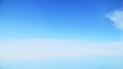 Wall Mural - Aerial view of white clouds, from airplane window with blue sky