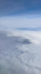 Wall Mural - blue sky with clouds from above vertical 