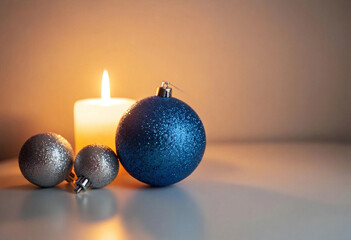Wall Mural - a medium shot of silver and blue holiday ornaments beside a candle holder, decorated with sparkling 