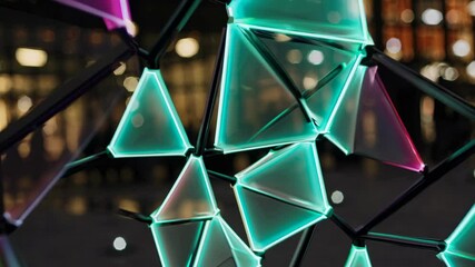 Aufkleber - Colorful geometric shapes illuminate urban space at night with vibrant lights in a modern art installation in the city
