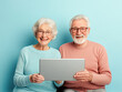 © Kowit - Elderly couple using laptop home lifestyle indoor close-up connection