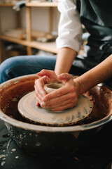 Poster - Process of making a unique ceramic shape. Potter creates a ceramic bowl in the pottery studio.