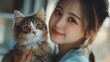 © CinimaticWorks - cute cat being examined by Asian female veterinarian in pet clinic, professional medical diagnosis and healthcare treatment