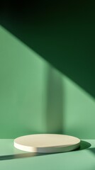 Poster - Minimalist green background featuring a white round podium, illuminated by soft window light, casting gentle shadows, creating an ideal setting for product display and presentation