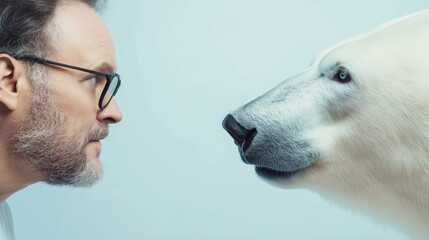 Wall Mural - mature man with glasses and a polar bear are face to face, highlighting the delicate balance between