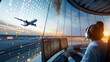 © Curioso.Photography - An air traffic controller in a modern tower monitoring a departing airplane at sunset.