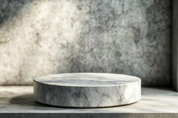 Poster - A round marble pedestal sits on a concrete surface, bathed in soft light against a textured backdrop.