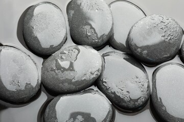 Wall Mural - Spa stones on water surface, flat lay