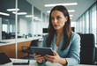 © wetzkaz - confident businesswoman in office holding tablet for work or research