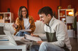 © Miljan Živković - two students man and woman use laptop for prepare exam at home