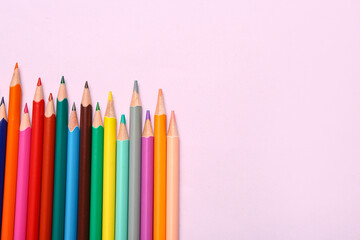 Wall Mural - Group of colorful pencils on light pink background