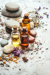 Wall Mural - Aromatic essential oils and botanical ingredients. Wellness, beauty and spa background