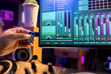 Poster - Sound designer copying audio recordings from an usb stick to start editing the tracks in post production, workstation in home studio. Mixing and mastering songs for the music industry. Close up.