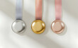 © Gustav - Trio of metallic medals displaying achievement and recognition with silver, gold and bronze ribbons against a clean, bright backdrop