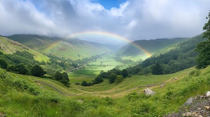 Poster - A wide-angle view of a double rainbow stretching across a lush green valley, mist from a recent summer rain enhancing the serene atmosphere