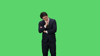 Leinwandbilder - 悩ましく考える男性ビジネスパーソン　クロマキー合成用グリーンバック映像