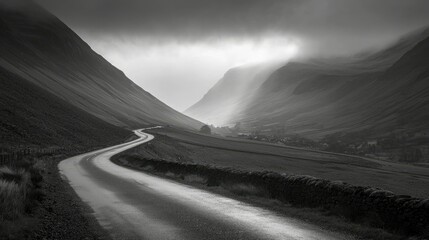 Wall Mural - Serene Curved Road Through Misty Valleys in Black and White