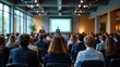 © saranya - businessmen and businesswomen in conference room, listening to the speakers which is on stage attentively