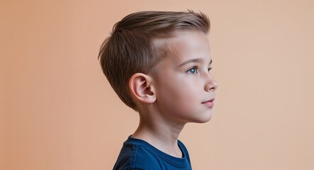 Canvas Print - Orange background Caucasian boy side view portrait on plain white background