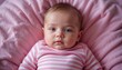 © FrameExpert - Adorable Baby Girl with Bright Blue Eyes Lying on a Pink Blanket, Peaceful Infant Portrait