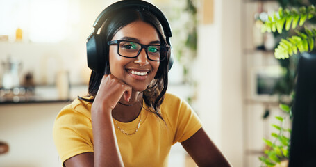 Poster - Music, portrait and smile with Indian woman in home office as graphic designer for marketing campaign. Headphones, laptop and remote work with happy freelance employee in apartment for publication