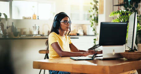 Poster - Laptop, music and remote work with Indian woman in home office as graphic designer for marketing campaign. Computer, headphones and illustration with freelance employee in apartment for publication