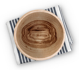 Wall Mural - Rustic wooden bowl on a striped kitchen napkin over a white background, top view. Natural and eco-friendly tableware for organic dining and food presentation.