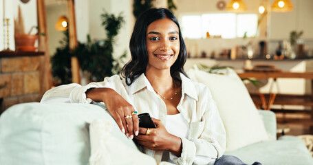 Aufkleber - Woman, smartphone and smile in portrait on sofa, home and pride with chat, web and contact in lounge. Girl, person and happy with phone, relax and mobile app for social media at apartment in India