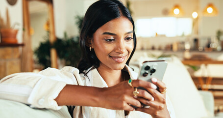 Aufkleber - Relax, smartphone and happy woman typing in home on app, reading blog or post comment on online forum. Living room, mobile and Indian girl chat on social media, notification or play game on internet