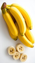 Wall Mural - Ripe Yellow Bananas and Slices on White Background