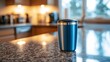 © atipong - Quiet Morning Reflections: Travel Mug on Glittering Granite Counter
