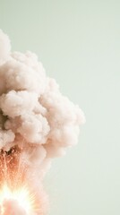 Wall Mural - White Smoke Explosion with Orange Sparks Against a Pale Green Background