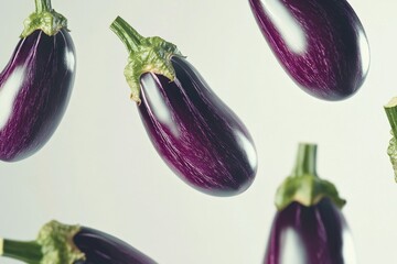 Sticker - Purple eggplant fruits in a white background. They appear fresh and vibrant, suggesting they are ready to eat or use for cooking.