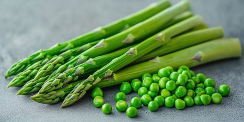 Wall Mural - Fresh asparagus and peas on a kitchen counter for a healthy and visually appealing meal.