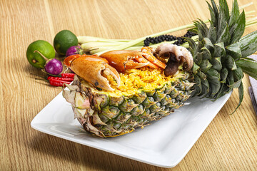 Wall Mural - Rice with seafood in pineapple