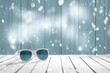 © shafiyyah - White sunglasses on snowy wood, winter background, travel