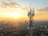 Telecommunication tower cellular network antenna on city background