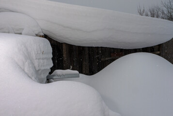 Poster - A car is covered in snow