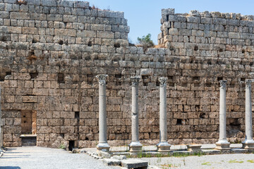 Wall Mural - Ancient stone wall with Corinthian columns at Perge archaeological site. Antalya, Turkey (Turkiye)