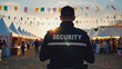 © Patrick - Security guard, festival surveillance and crowd safety at outdoor event, sunset and fairground with tents. Professional monitoring, entertainment venue and public protection for concert safety