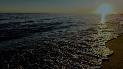 Wall Mural - waves crashing against the seashore at night